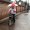 Beijing : Cycling with Umbrella
